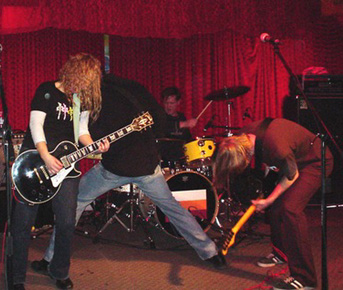 Rocking out (l-r): Kris, Brad, Dave, Moe.  Photo by Mark Inward